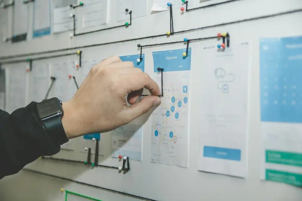 IT professional planning network infrastructure on a whiteboard, representing managed IT services
